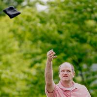 A play throws a bag and watches if fly through the trees